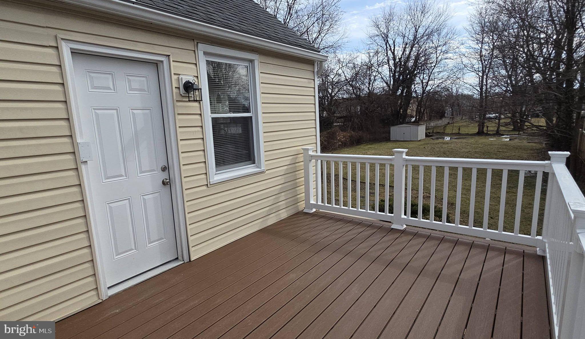 2329 Foster Avenue Baltimore, MD 21234 - Photo 12 of 47 New PVC deck with vinyl rails.