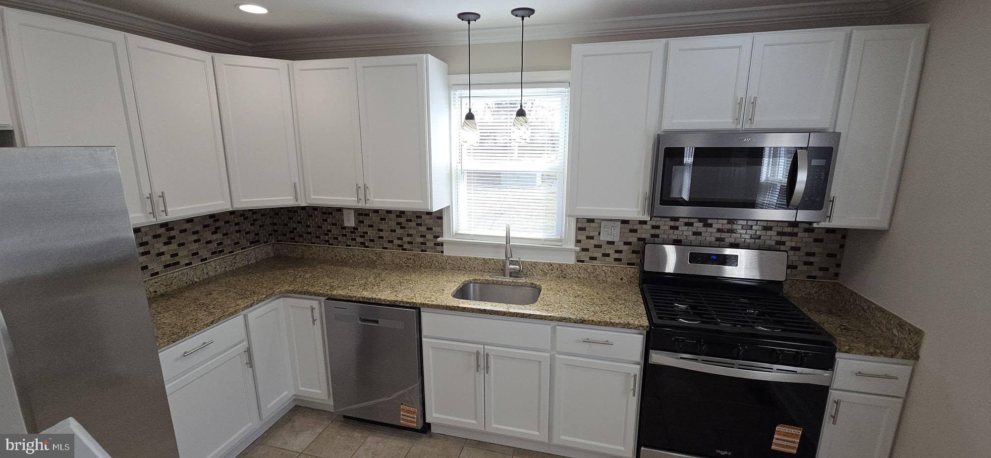 2329 Foster Avenue Baltimore, MD 21234 - Photo 18 of 47 Modern kitchen with granite tops & new appliances.