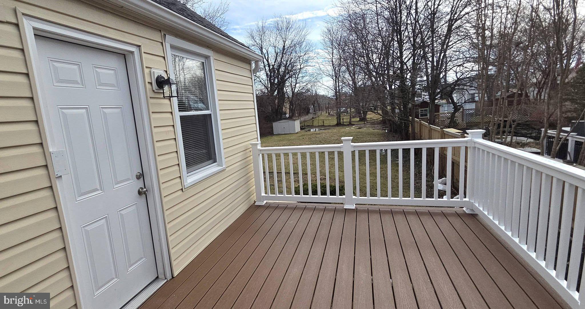 2329 Foster Avenue Baltimore, MD 21234 - Photo 10 of 47 New PVC deck with vinyl rails.