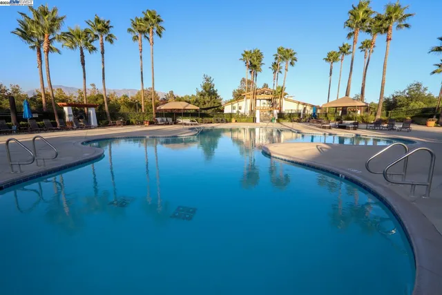 a view of a patio with swimming pool