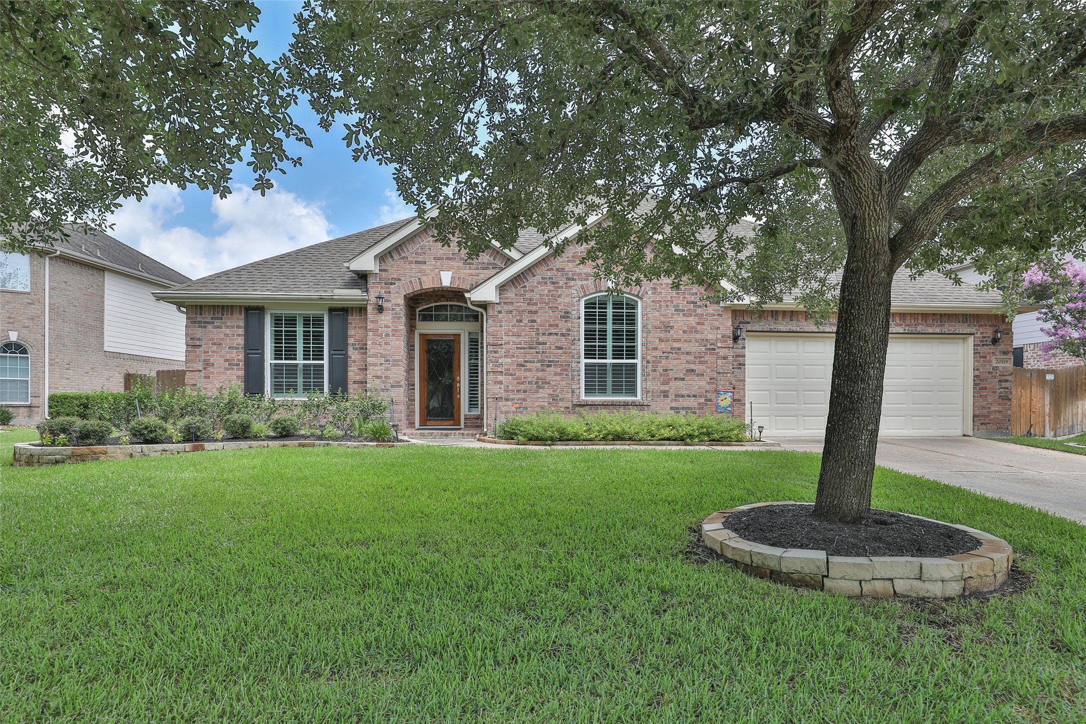 20519 Windrose Bend Drive Spring, TX 77379 - Photo 1 of 37 Enjoy the exceptional curb appeal of this beautiful brick elevation, featuring an extended driveway, mature trees, and meticulously maintained lawn and landscaping.