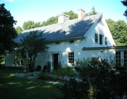 295 Ridgefield Road Wilton, CT 06897 - Photo 1 of 1 a view of a house with a yard potted plants and large tree