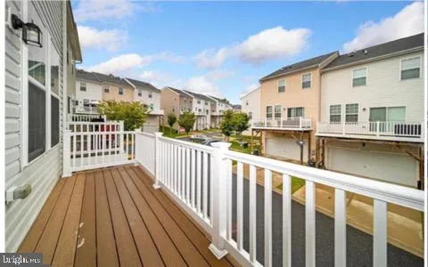 a view of a house with wooden deck