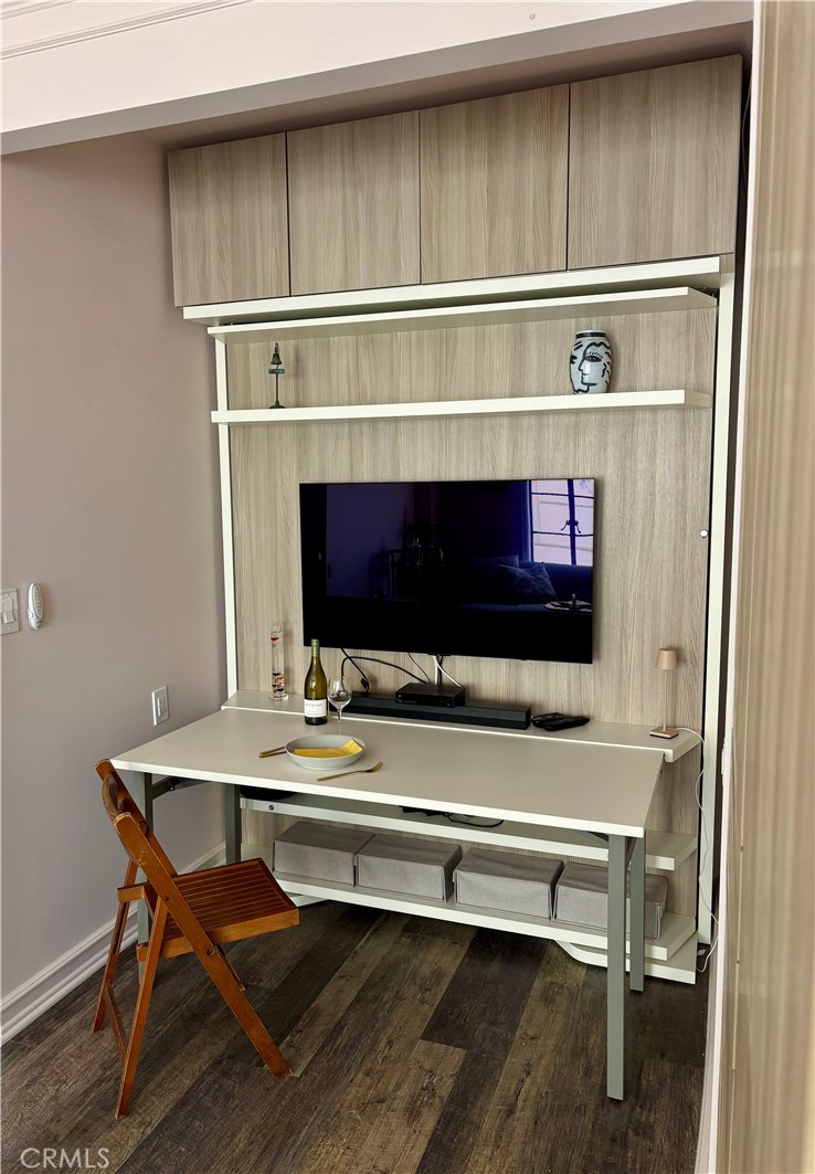 800 East Ocean Boulevard, Unit 1007 Long Beach, CA 90802 - Photo 11 of 43 a living room with a fireplace and a table