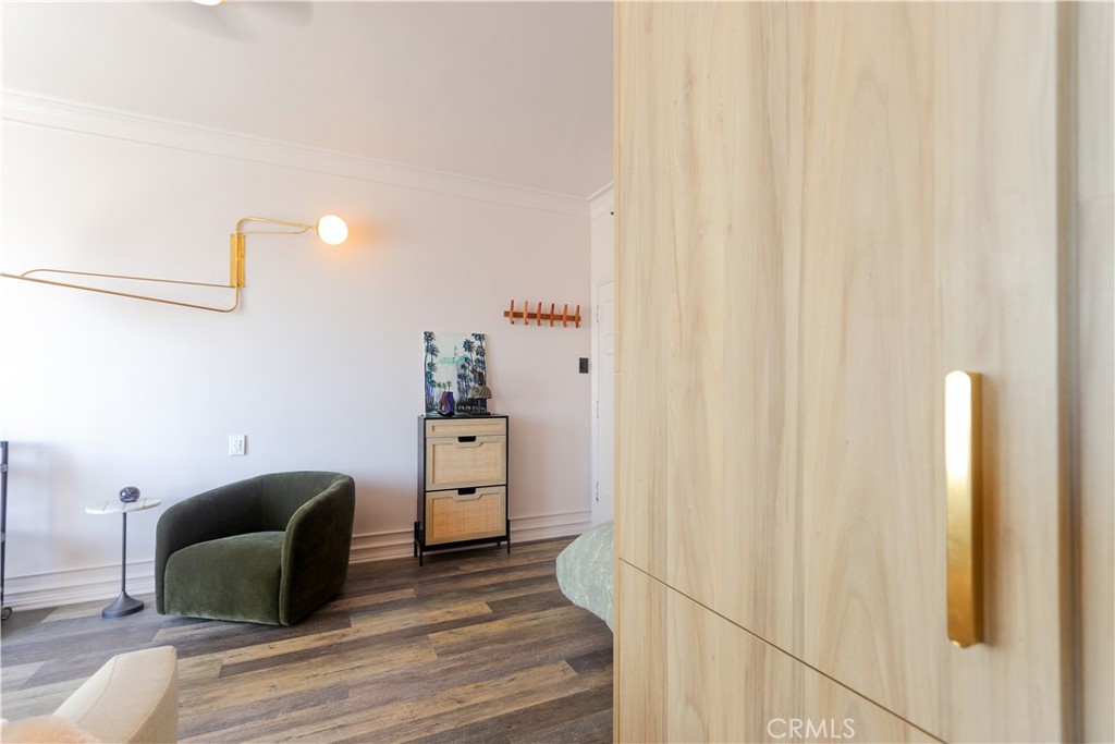 800 East Ocean Boulevard, Unit 1007 Long Beach, CA 90802 - Photo 15 of 43 a bedroom with a bed and a chair