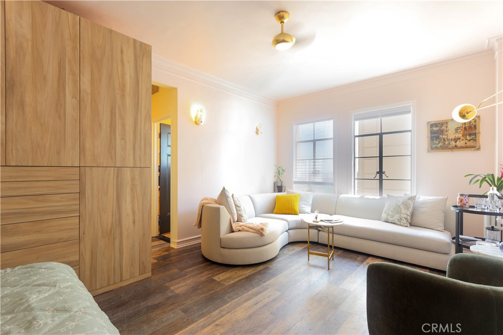 800 East Ocean Boulevard, Unit 1007 Long Beach, CA 90802 - Photo 6 of 43 a living room with furniture and wooden floor