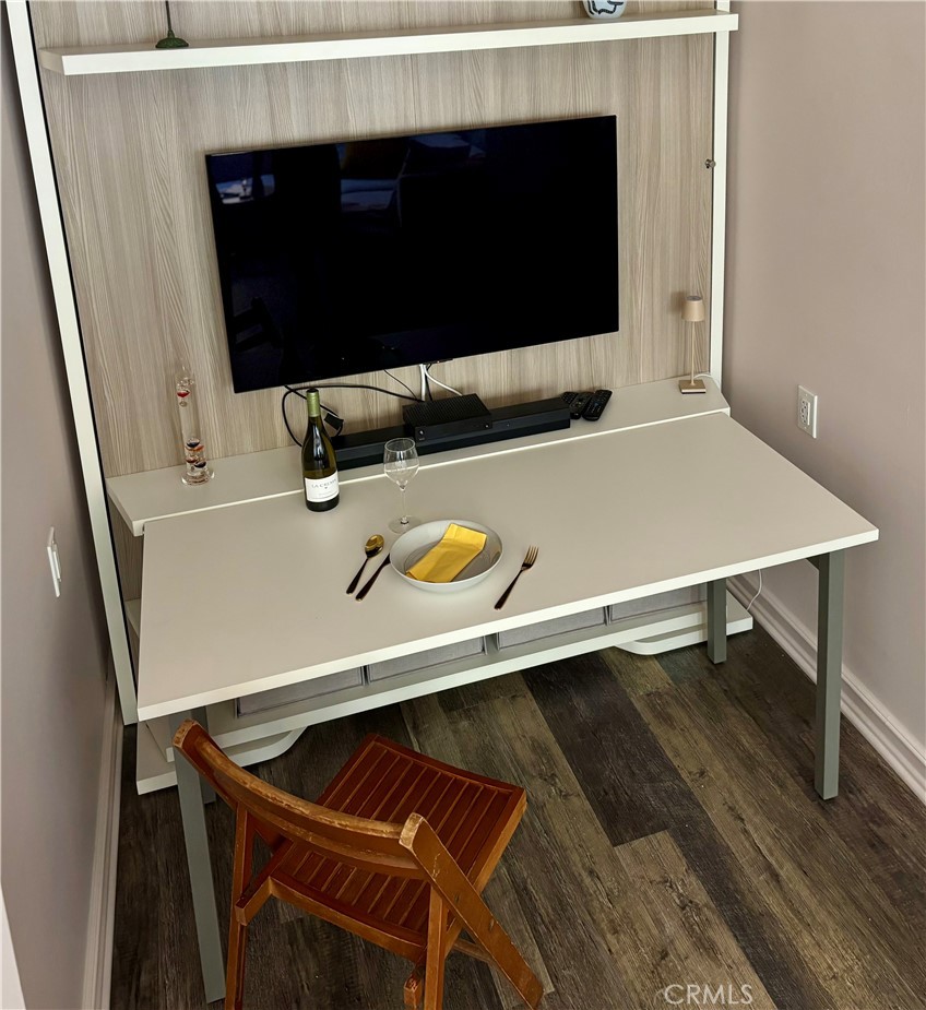 800 East Ocean Boulevard, Unit 1007 Long Beach, CA 90802 - Photo 9 of 43 a laptop sitting on top of a table