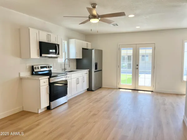 a large kitchen with cabinets