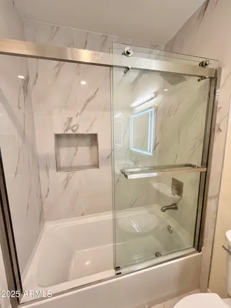 a kitchen with stainless steel appliances a stove top oven and sink