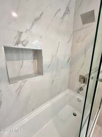 a kitchen with stainless steel appliances a refrigerator and a stove top oven