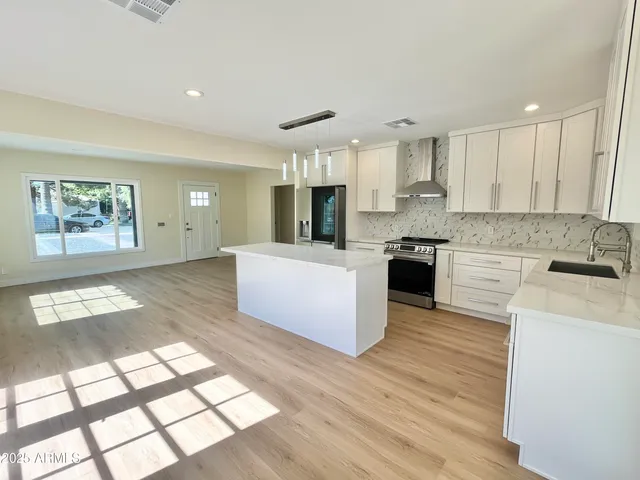 an aerial view of houses with outdoor space