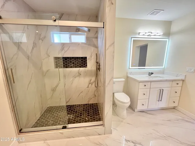 an aerial view of a house with a yard basket ball court and outdoor seating