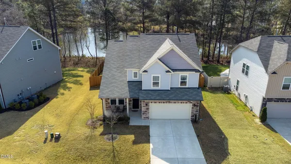 a aerial view of a house with swimming pool