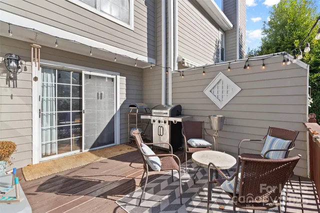 a view of a chairs and table in the balcony