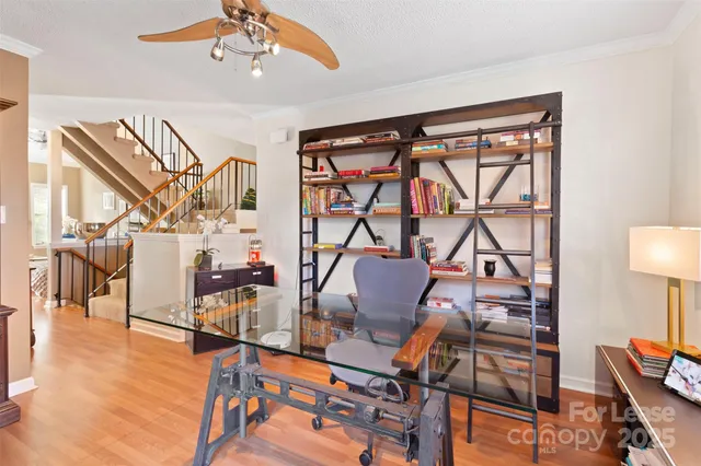 a living room with lots of furniture and a chandelier