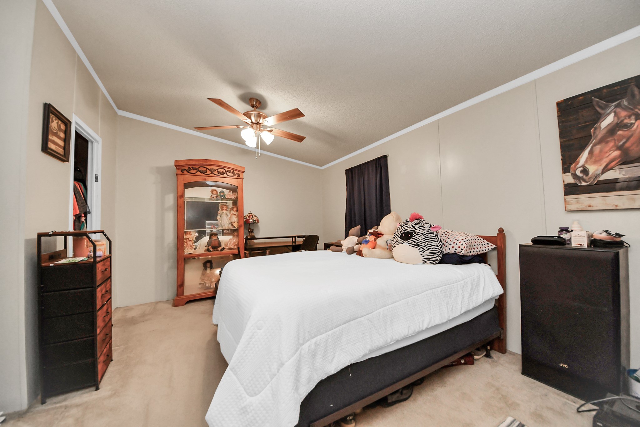 204 Edith Street Highlands, TX 77562 - Photo 15 of 33 a bedroom with a bed and a flat screen tv