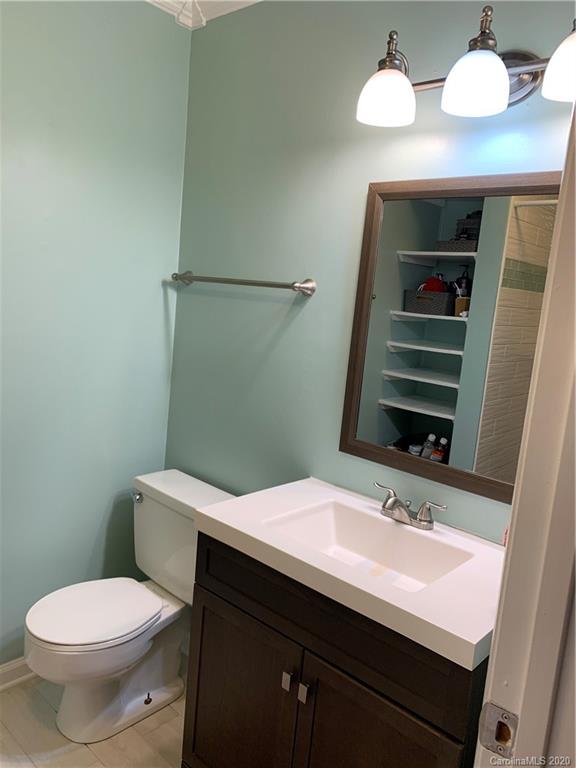 5923 Quail Hollow Road, Unit B Charlotte, NC 28210 - Photo 11 of 15 a bathroom with a sink and a mirror