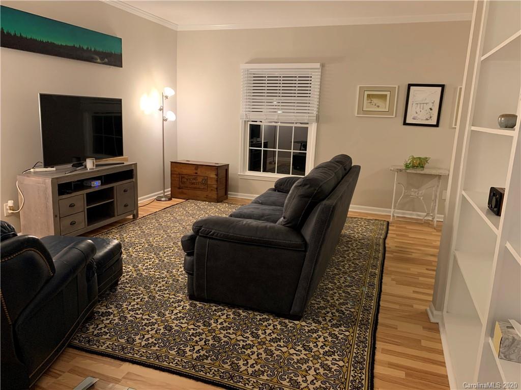 5923 Quail Hollow Road, Unit B Charlotte, NC 28210 - Photo 3 of 15 a living room with furniture and a flat screen tv