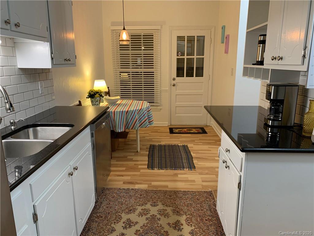 5923 Quail Hollow Road, Unit B Charlotte, NC 28210 - Photo 6 of 15 a kitchen that has a sink and a stove