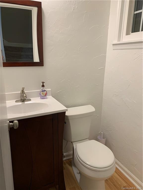 5923 Quail Hollow Road, Unit B Charlotte, NC 28210 - Photo 7 of 15 a bathroom with a sink toilet and mirror