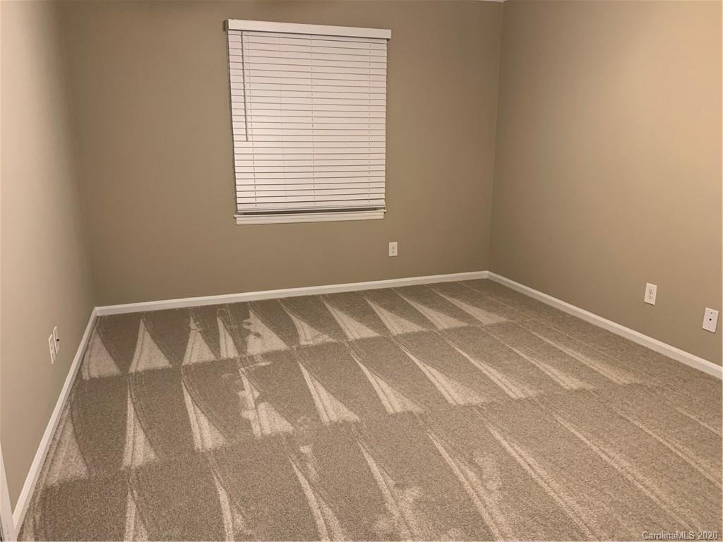 5923 Quail Hollow Road, Unit B Charlotte, NC 28210 - Photo 10 of 15 a view of an empty room with a window