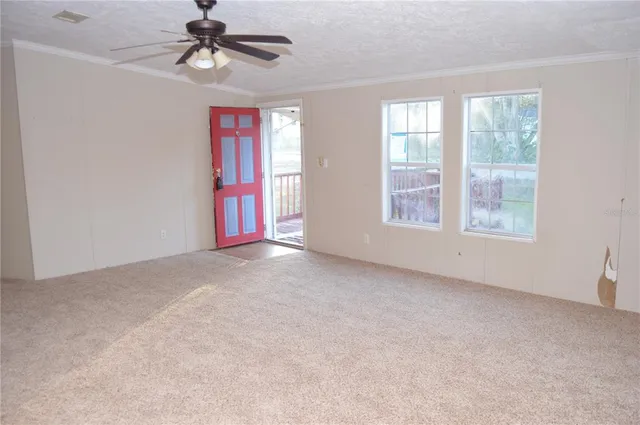 a view of kitchen with granite countertop cabinets and sink