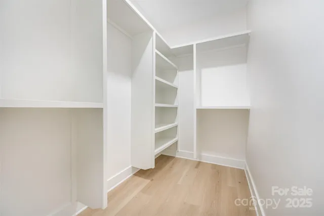 a view of an empty walk in closet