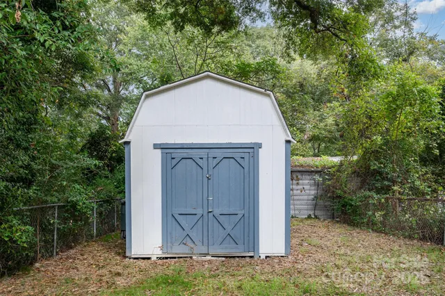 a view of house with backyard