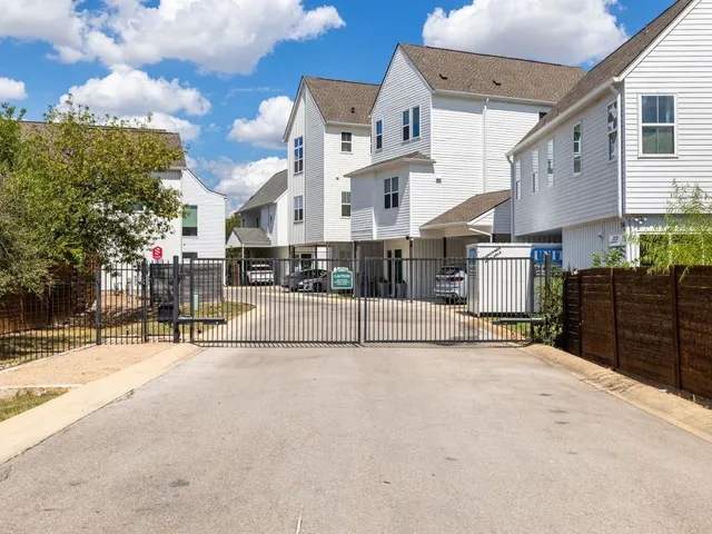 a view of a building with cars