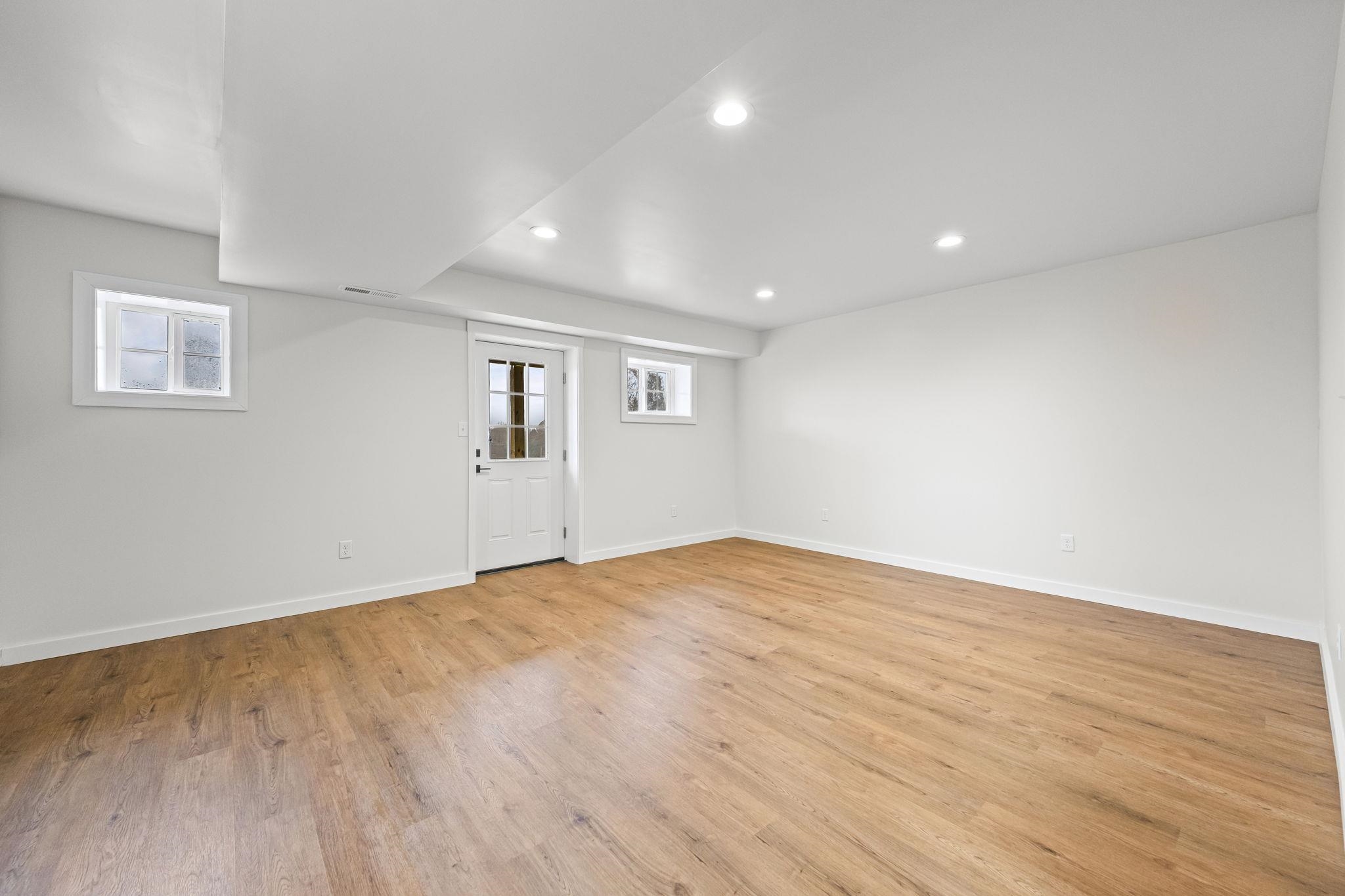 835 Curve Woodville Road Gates, TN 38037 - Photo 25 of 30 Empty room with light wood-style floors and recessed lighting