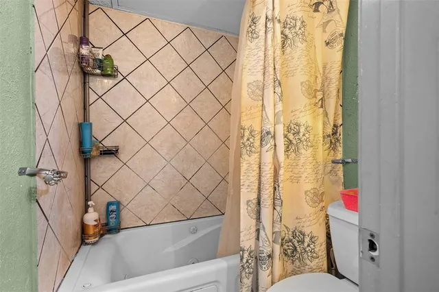 a bedroom with a bed and a table in it