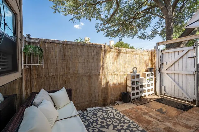 a view of a house with a small yard and plants
