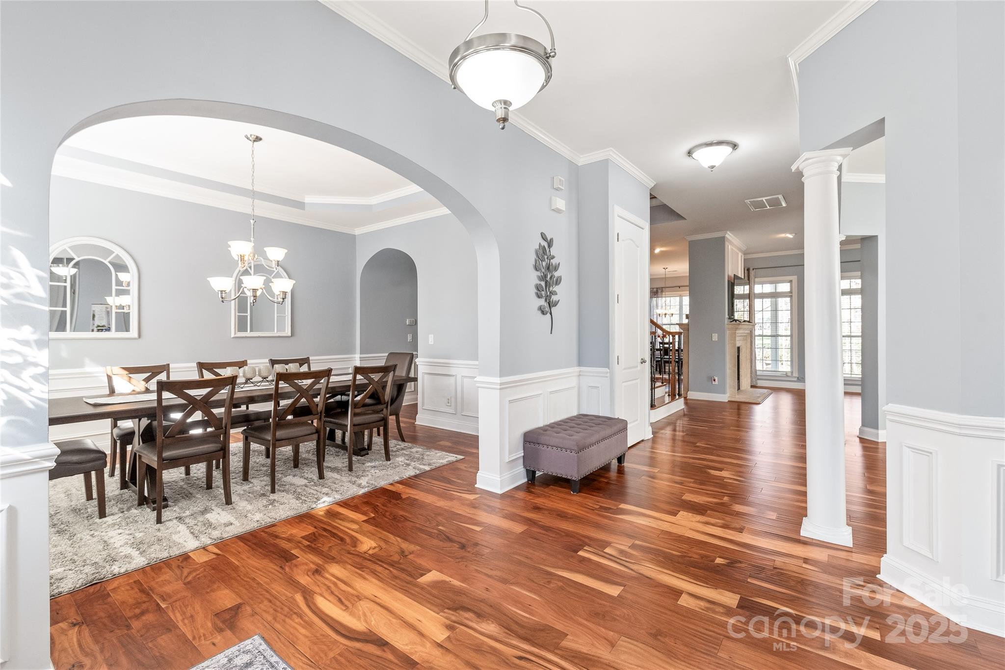 8504 Soaring Eagle Lane Waxhaw, NC 28173 - Photo 3 of 48 a view of a dining area with furniture and wooden floor