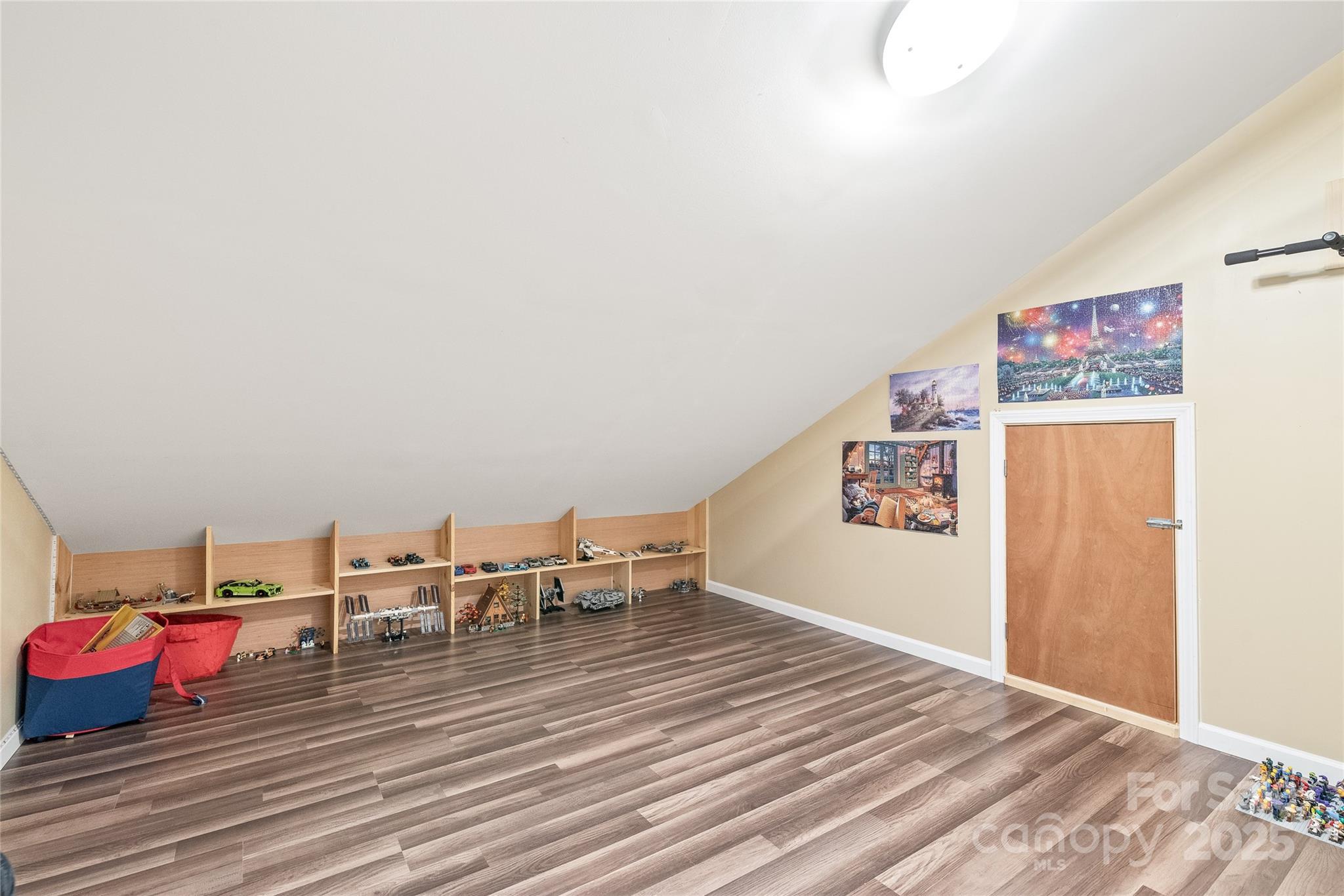 8504 Soaring Eagle Lane Waxhaw, NC 28173 - Photo 33 of 48 a view of a room with wooden floor and bench