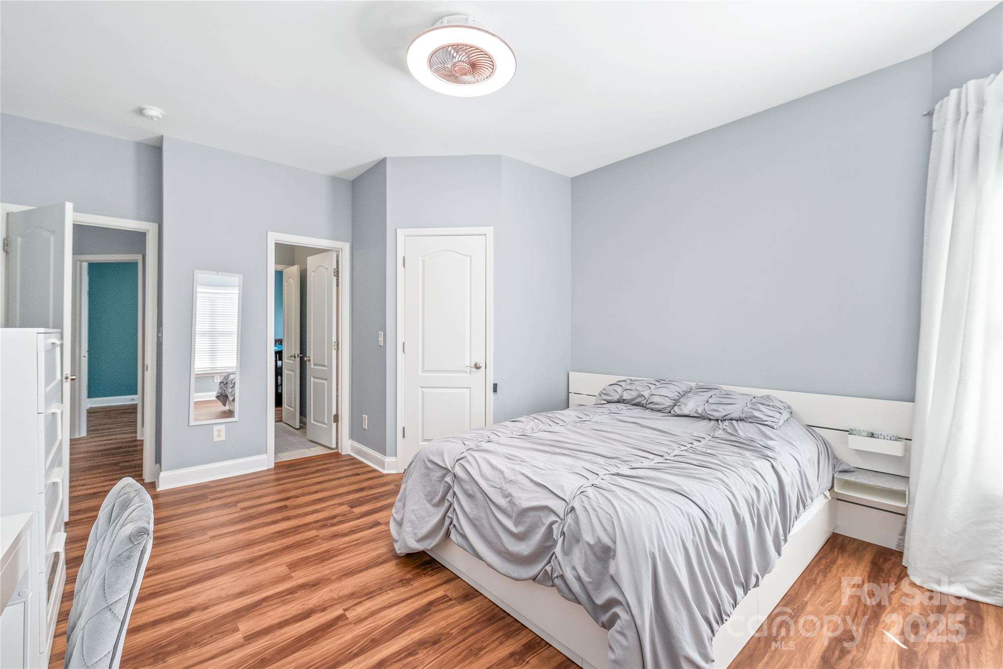 8504 Soaring Eagle Lane Waxhaw, NC 28173 - Photo 35 of 48 a bedroom with a bed and wooden floor