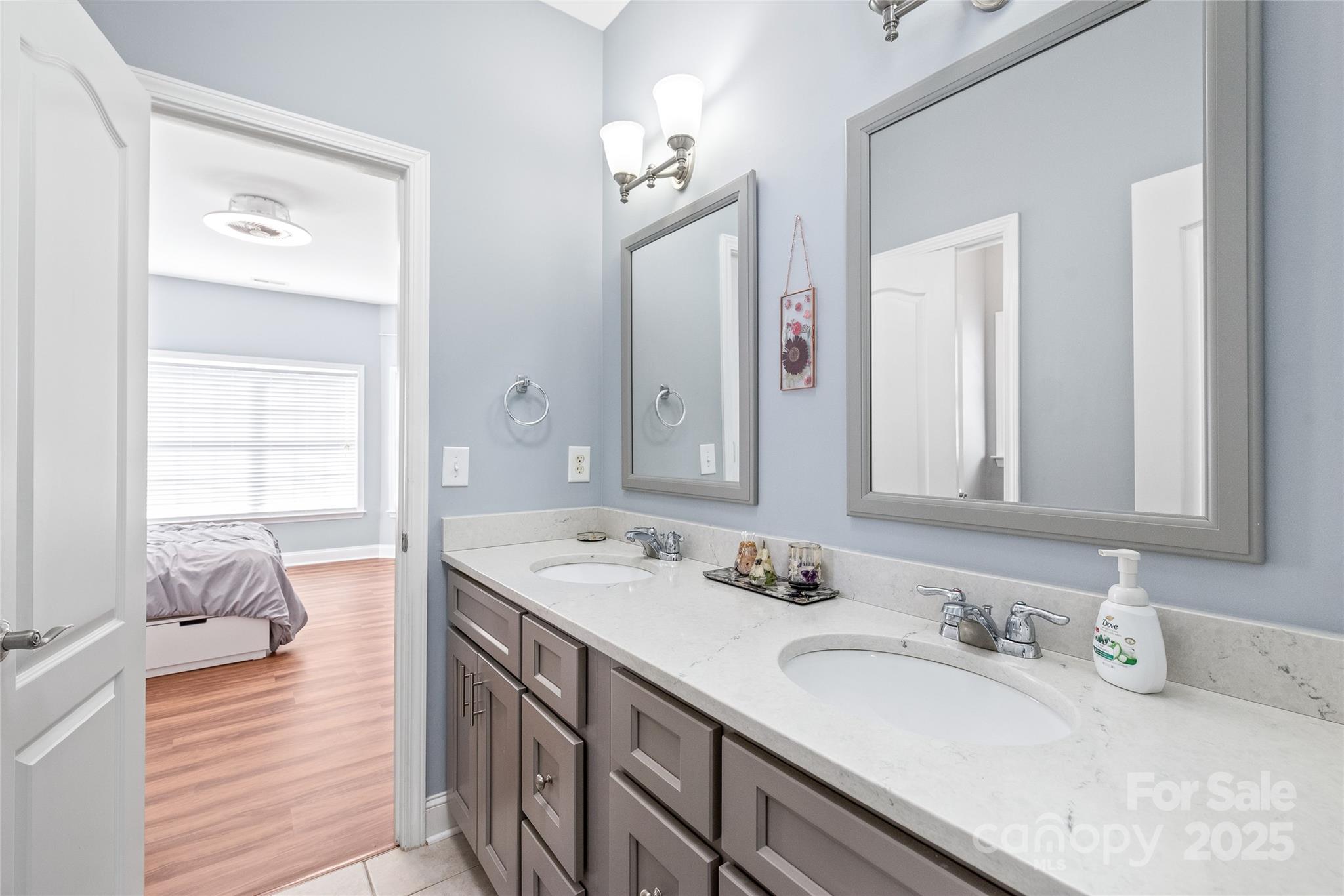 8504 Soaring Eagle Lane Waxhaw, NC 28173 - Photo 36 of 48 a bathroom with a sink double vanity and a mirror