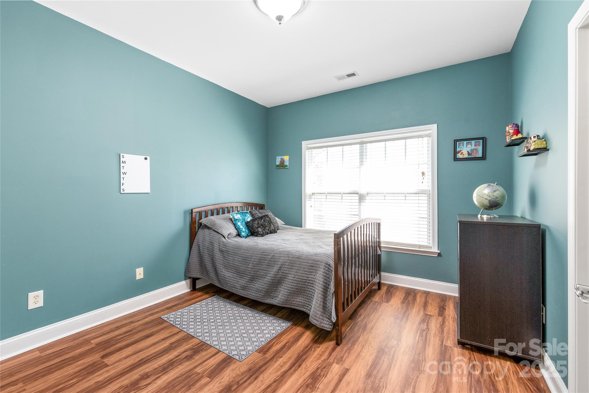 8504 Soaring Eagle Lane Waxhaw, NC 28173 - Photo 37 of 48 a living room with furniture and a window