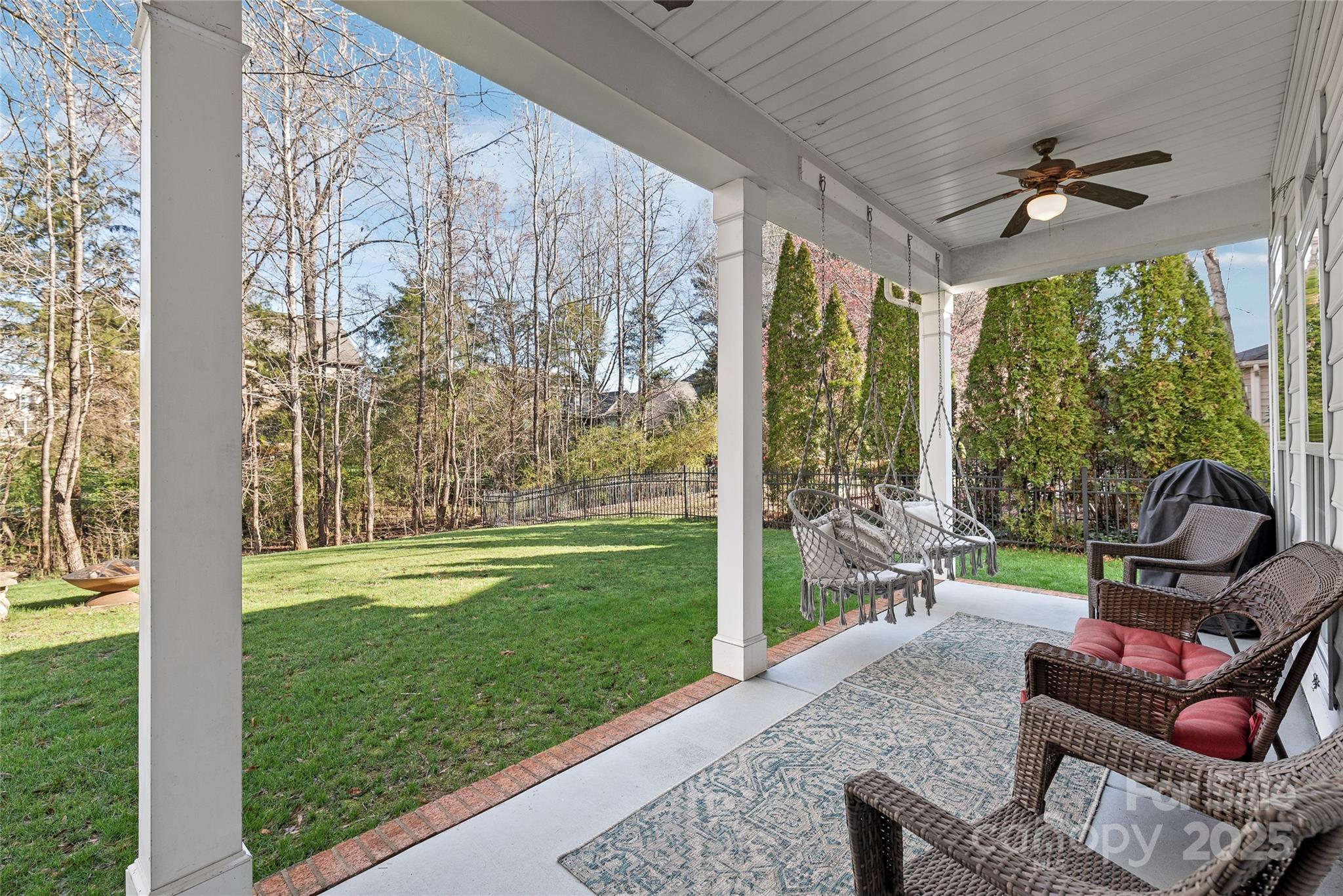 8504 Soaring Eagle Lane Waxhaw, NC 28173 - Photo 43 of 48 a view of a porch with furniture and garden