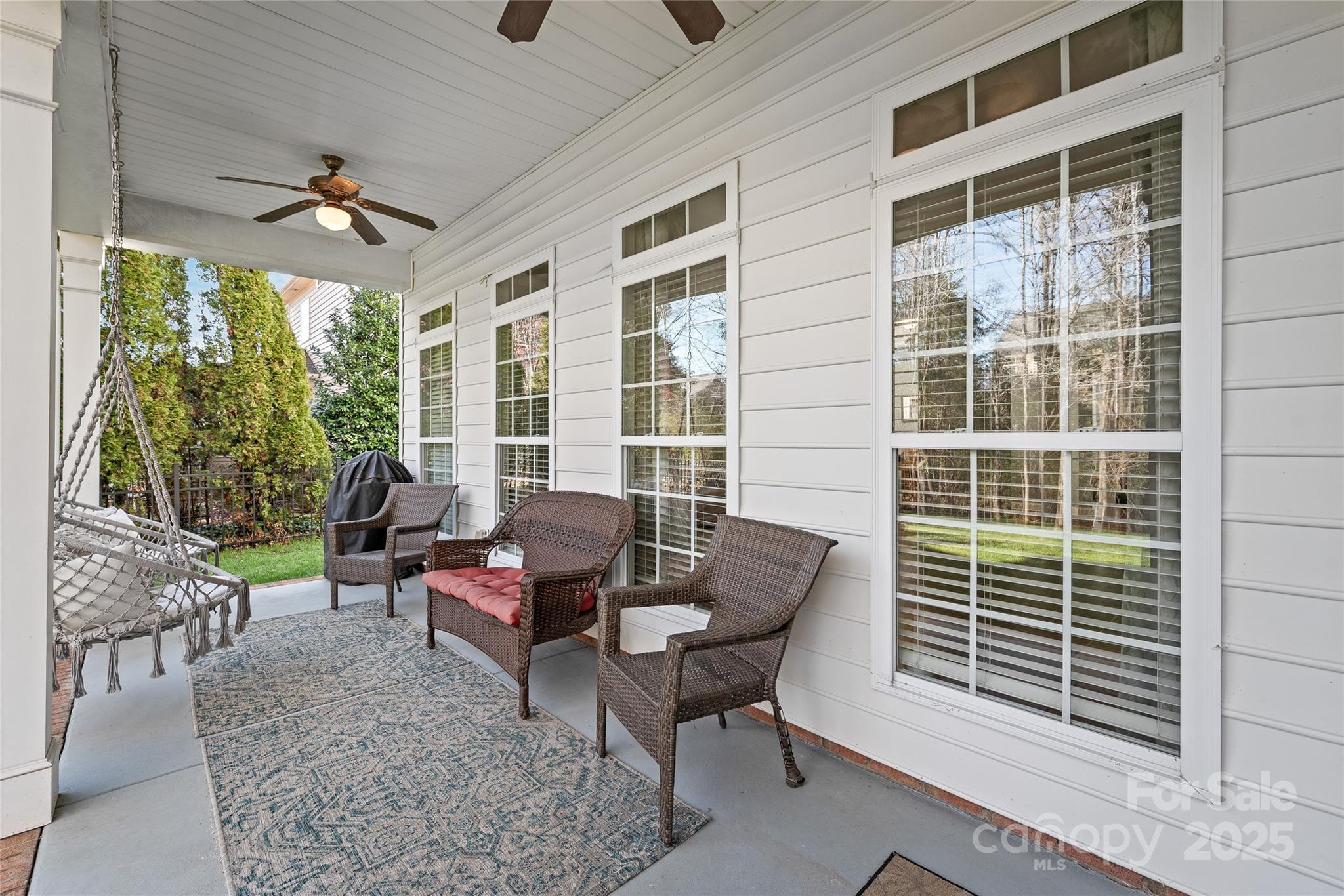 8504 Soaring Eagle Lane Waxhaw, NC 28173 - Photo 44 of 48 a living room with furniture and floor to ceiling windows