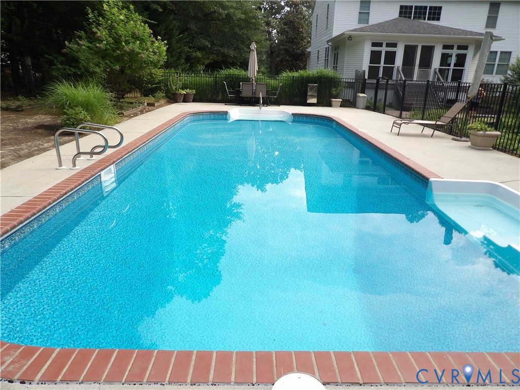 7106 Swiftrock Ridge Place Chesterfield, VA 23838 - Photo 4 of 4 Rectangular inground pool featuring a patterned li