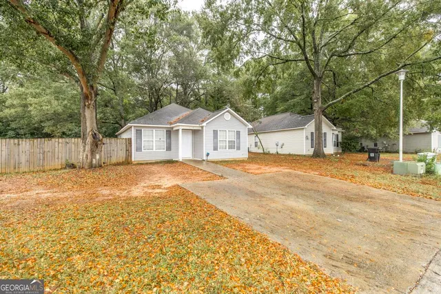 a house with trees in front of it