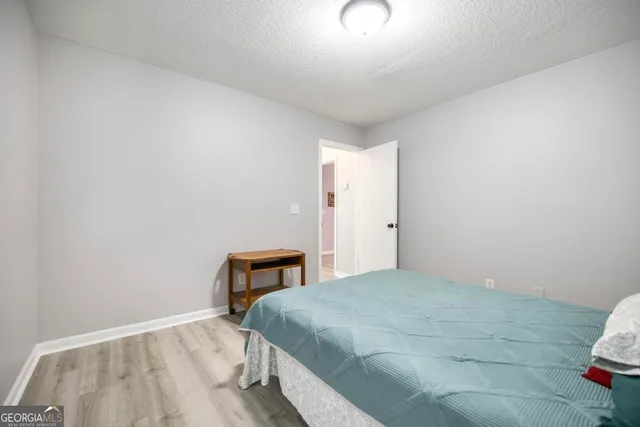 a bedroom with a bed and a table