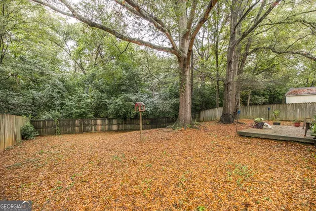 a view of a yard with a tree