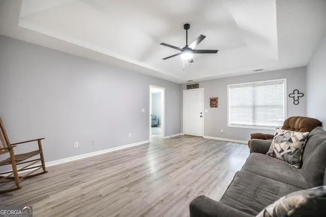 a living room with furniture and a window