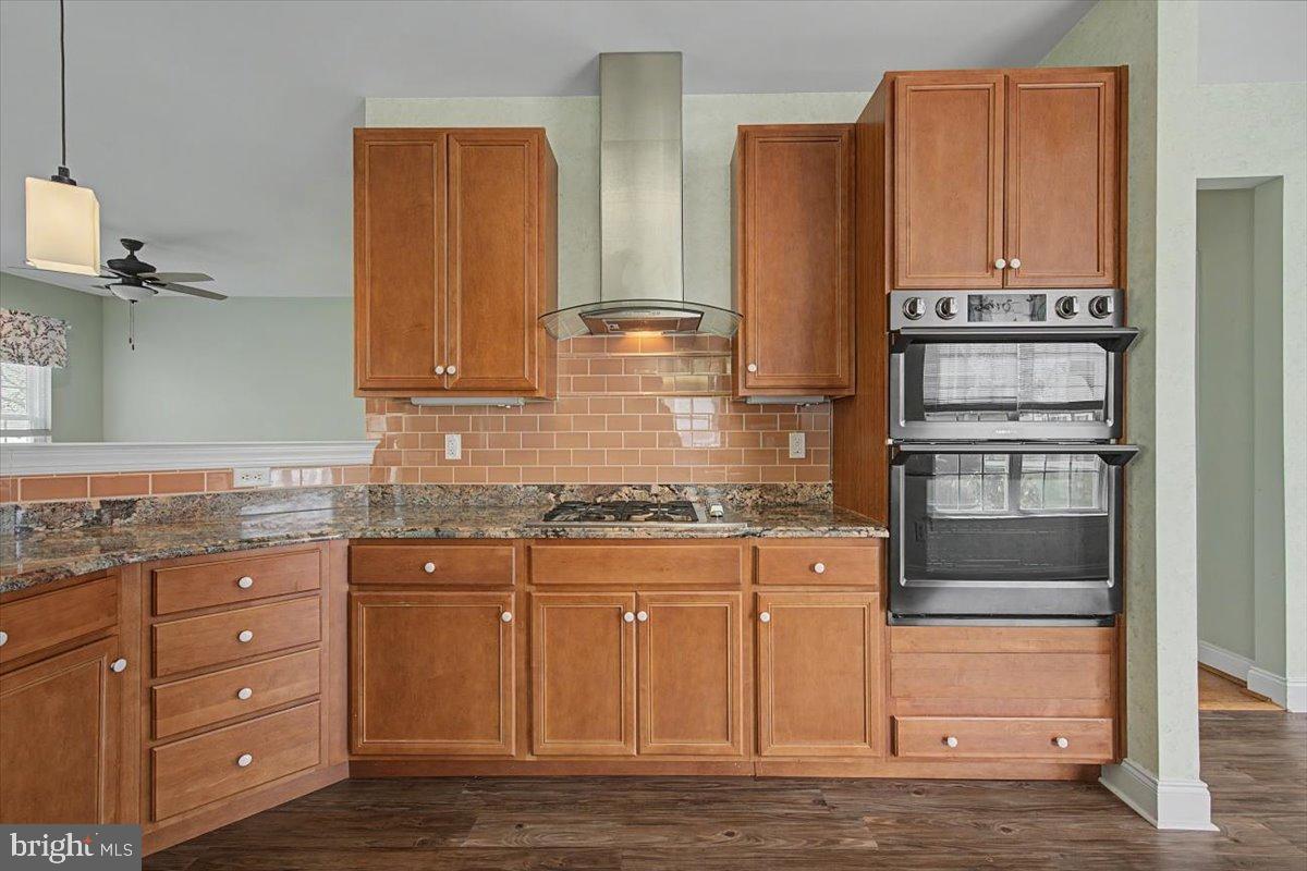 12 Springmill Drive Middletown, DE 19709 - Photo 11 of 31 a kitchen with stainless steel appliances granite countertop a stove and a refrigerator