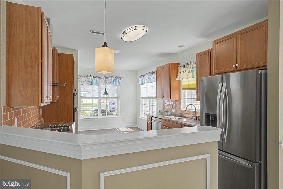 12 Springmill Drive Middletown, DE 19709 - Photo 12 of 31 a kitchen with stainless steel appliances a refrigerator a sink and a large window