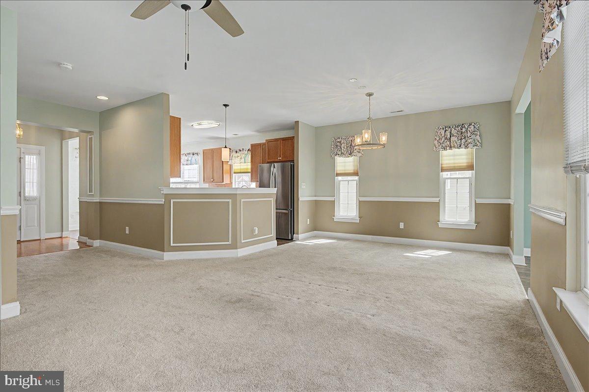 12 Springmill Drive Middletown, DE 19709 - Photo 13 of 31 an empty room with chandelier fan and windows