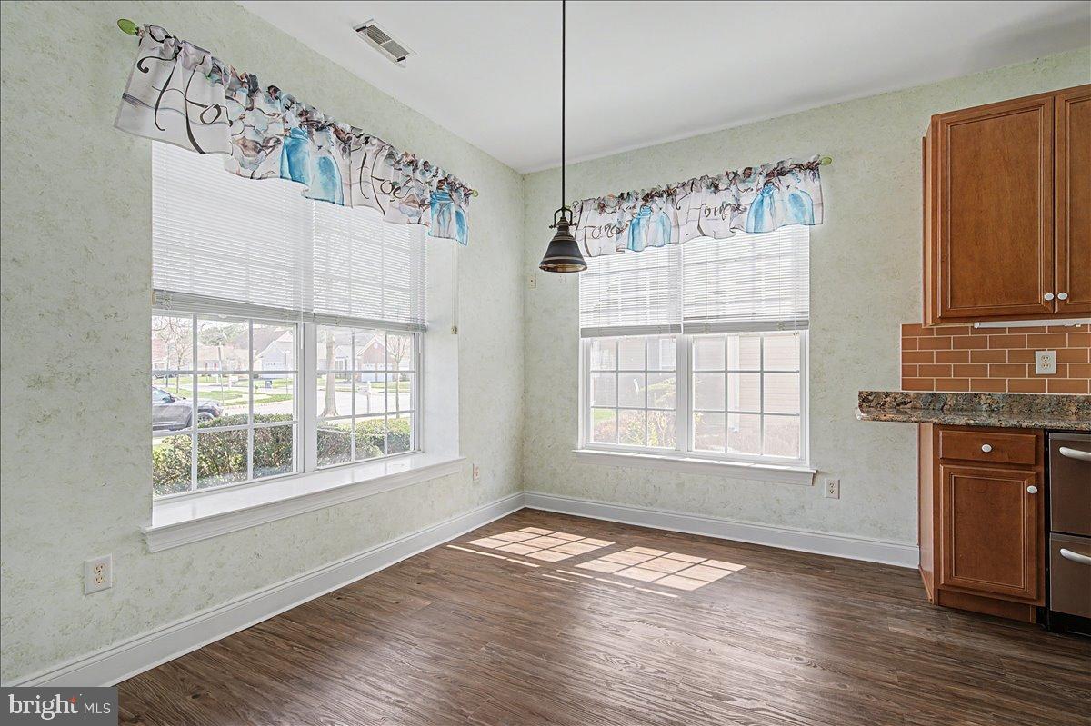 12 Springmill Drive Middletown, DE 19709 - Photo 6 of 31 a view of an empty room with wooden floor and a window