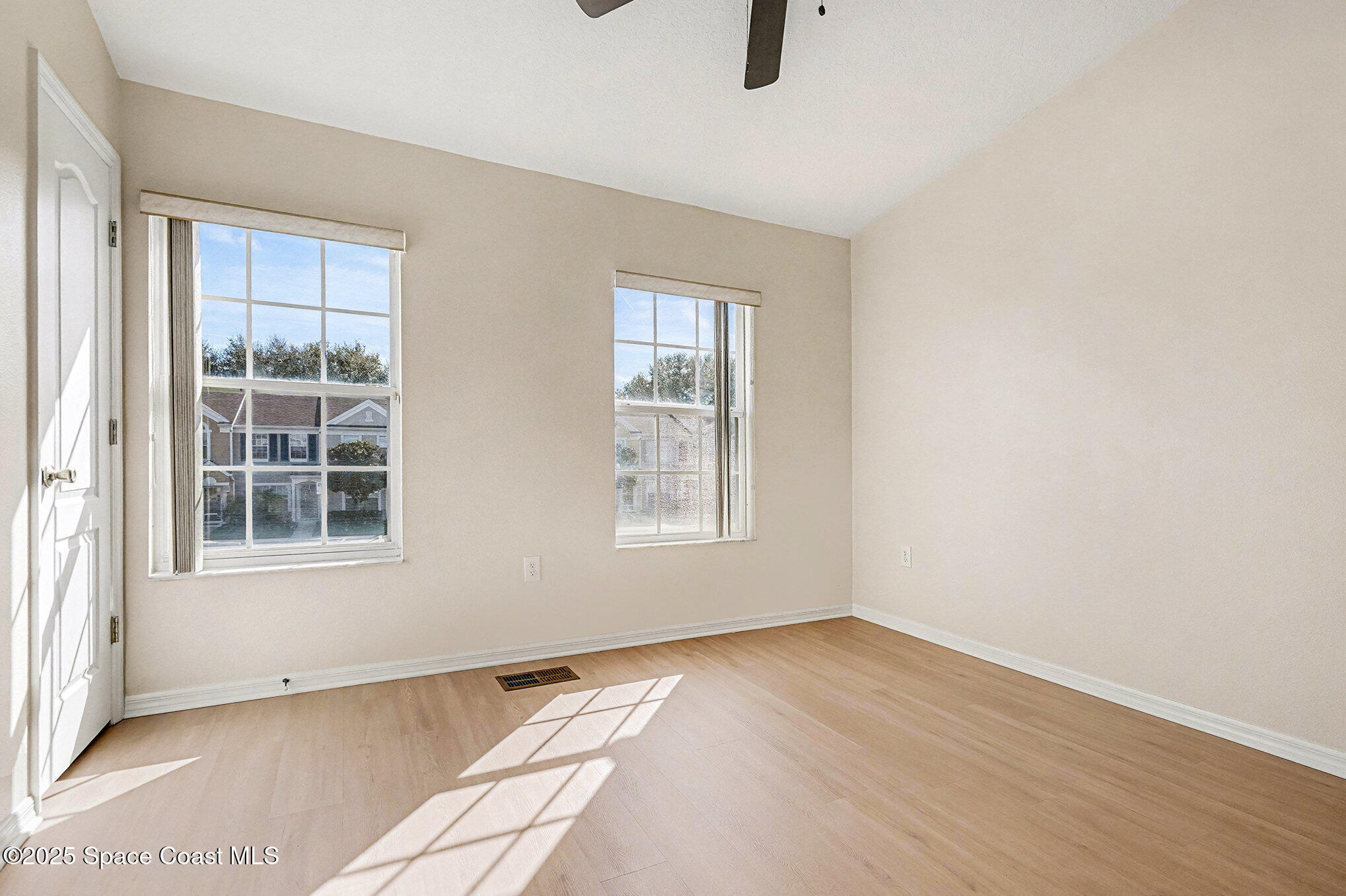 1352 Hampton Park Lane Melbourne, FL 32940 - Photo 10 of 15 an empty room with windows