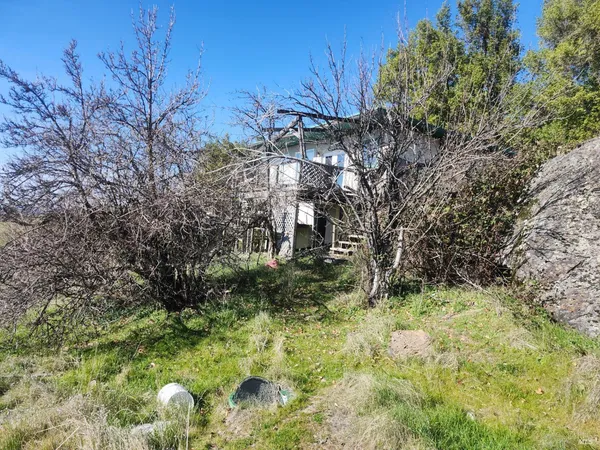 a backyard of a building with lots of green space